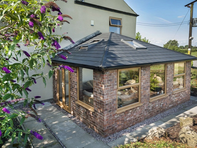 tiled-effect-roof-outside-looking-at-the-room-extensions-roof-with-skylights-and-one-on-latch-fitted-in-codsall