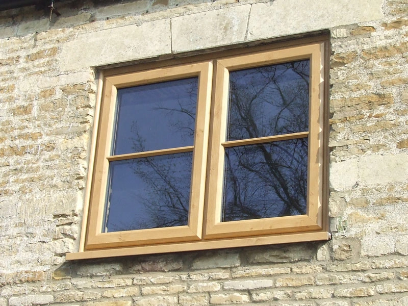 legacy-brick-wall-with-woodgrain-finish-on-window-frame-fitted-in-bracknell