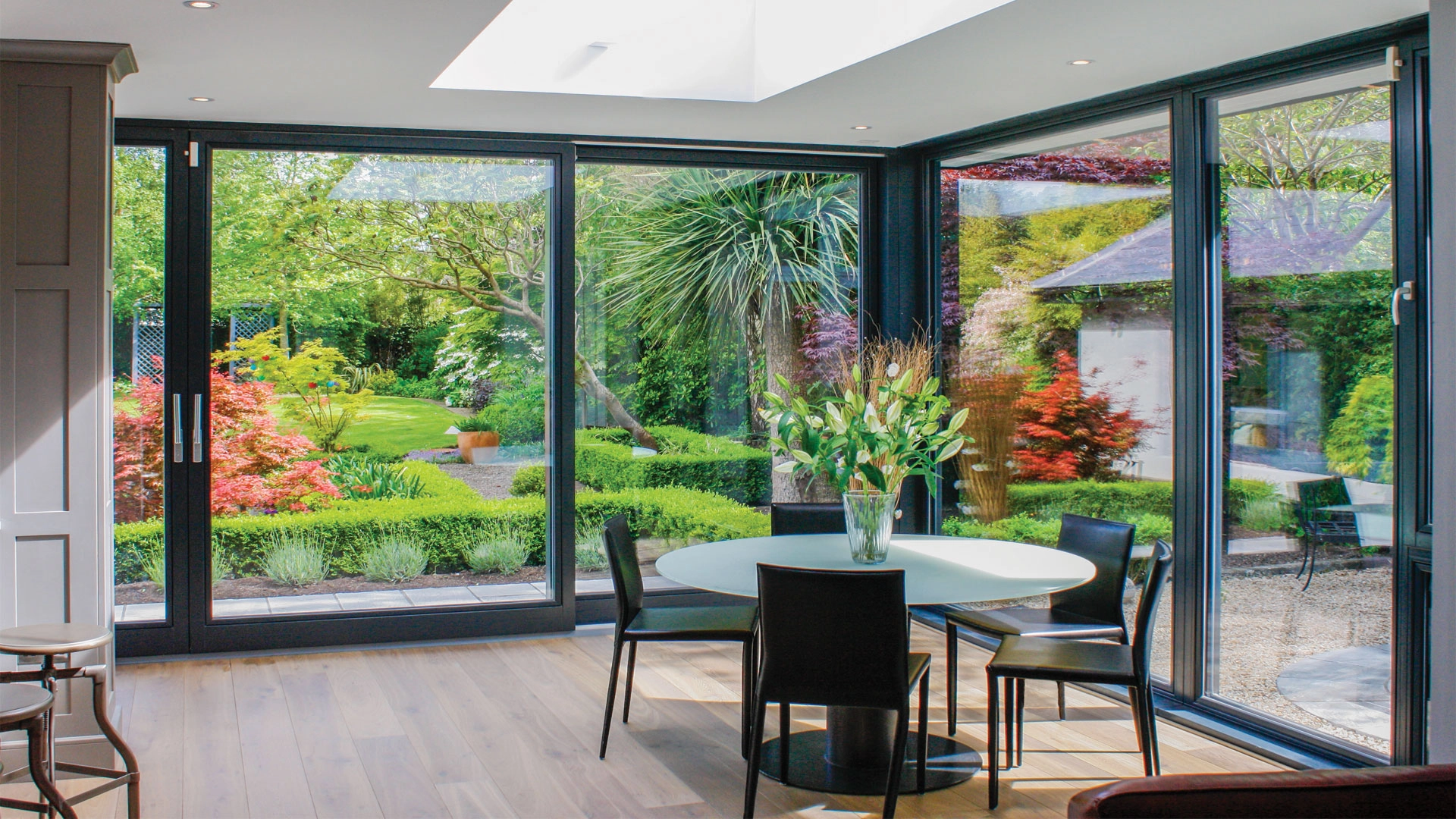 alu-clad-timber-doors-a-room-surrounded-with-massive-glass-doors-fitted-by-newglaze-windows-doors-conservatories-in-bedfordshire