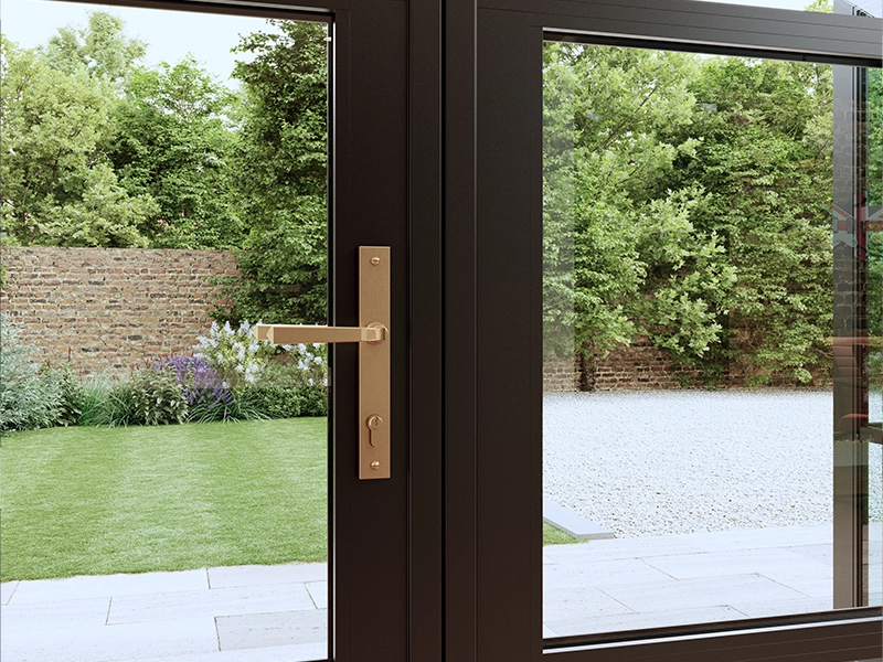 aluminium-heritage-doors-close-up-on-the-door-handle-and-showing-metal-bronze-coloured-fitted-in-bedfordshire