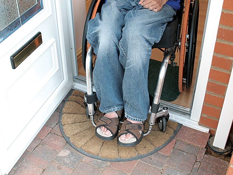 door-spec-opened-door-with-a-person-on-a-wheelchair-going-out-the-house-newglaze-windows-doors-conservatories-in-bedfordshire