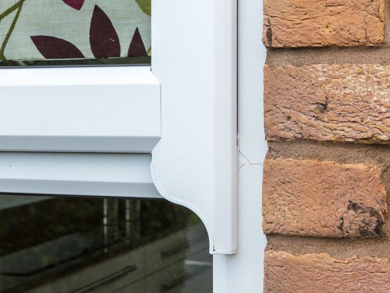runthru-sash-horns-looking-at-the-woodgrain-finish-of-multi-sided-opened-windows-fitted-in-bedfordshire