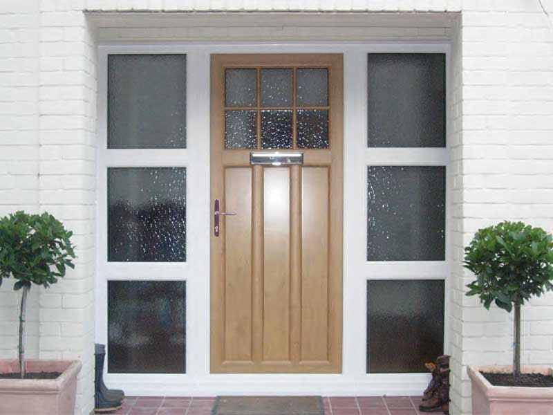 upvc-single-doors-looking-at-a-front-door-with-white-frames-around-the-door-and-windows-fitted-in-lincoln
