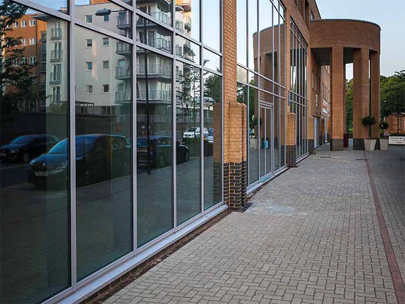 aluminium-commercial-product-large-wall-filled-with-windows-with-brick-pillars-fitted-in-oakham