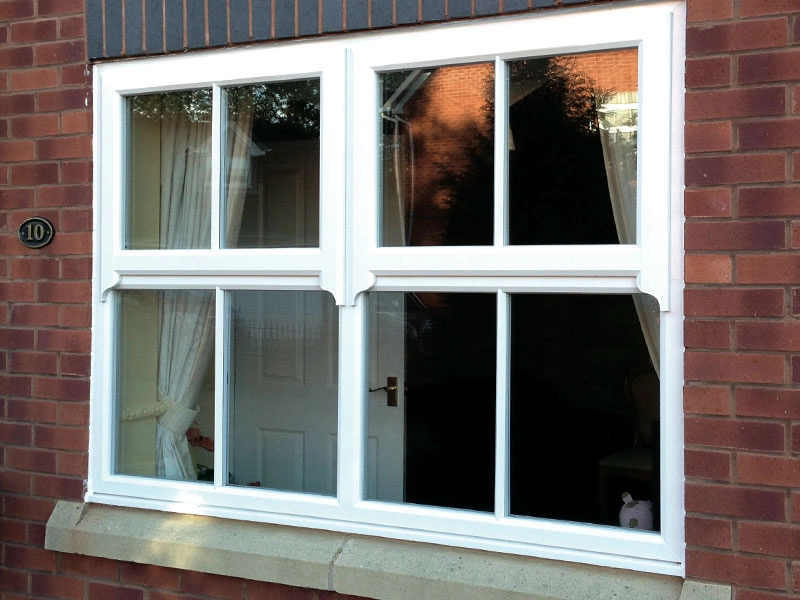 runthru-sash-horns-outside-looking-at-traditional-styled-white-window-frames-and-window-fitted-in-oakham