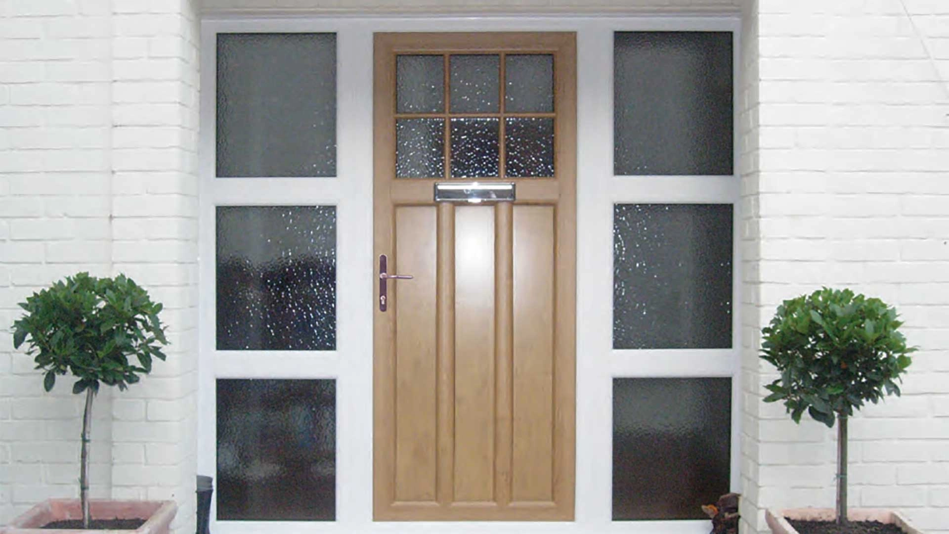 alternative-to-timber-doors-light-brown-wooden-finish-with-large-grid-windows-surrounding-door-fitted-by-ridon-glass-in-southampton