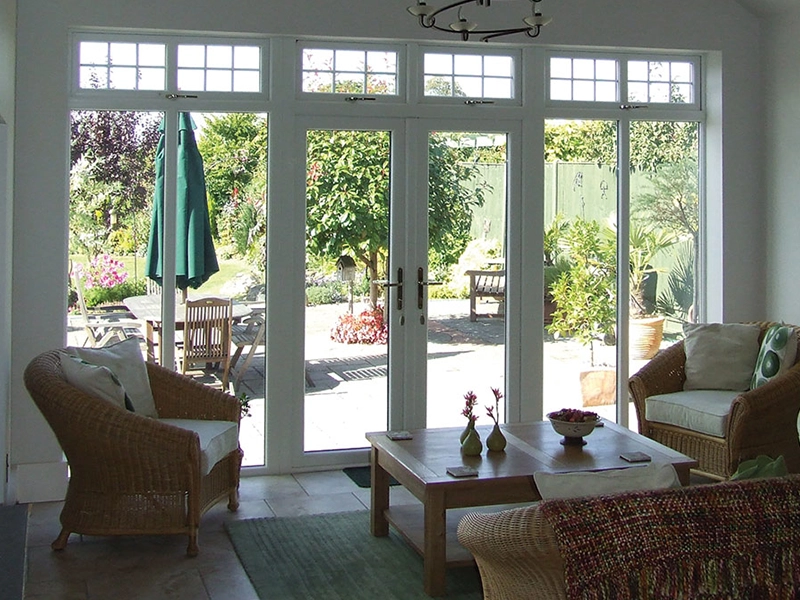 french-doors-inside-livingroom-looking-out-the-thin-and-tall-windows-in-the-double-door-fitted-in-southampton