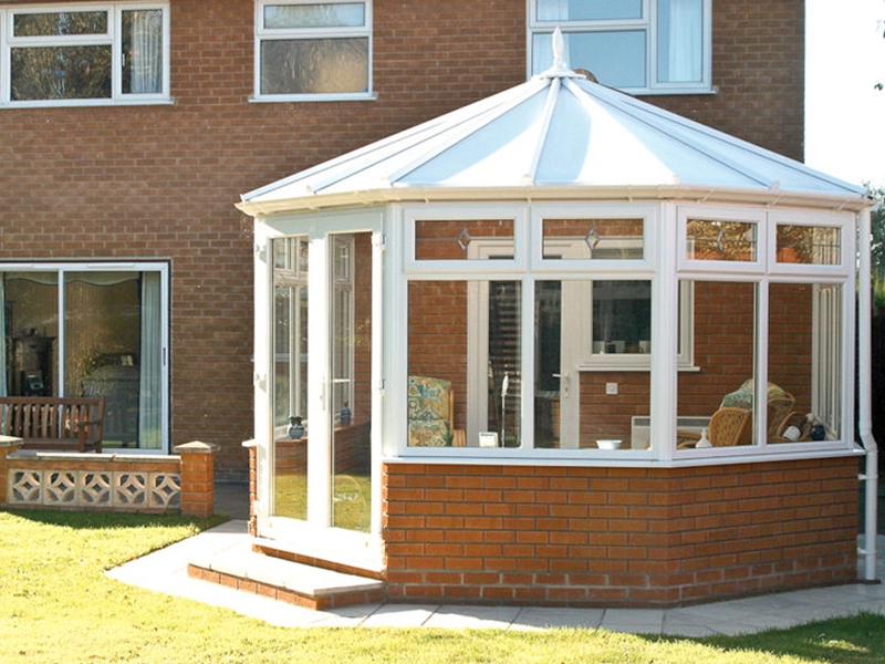 conservatories-looking-at-building-connected-to-a-house-with-cone-shaped-roof-fitted-in-woking