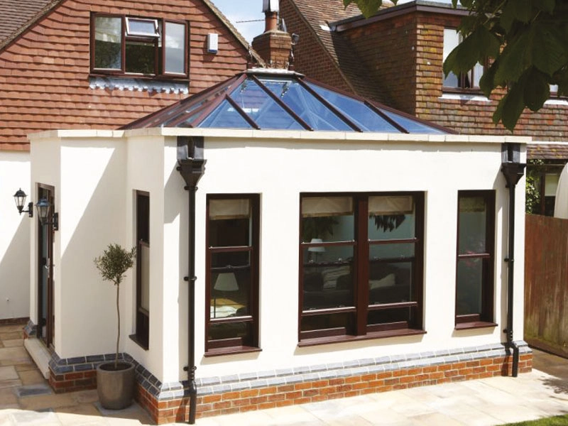 conservatories-outside-looking-at-conservatory-with-wooden-windows-and-glass-roof-fitted-in-woking
