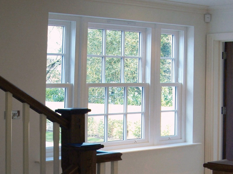 vertical-sliding-slash-inside-house-with-sliding-doors-at-the-bottom-of-a-staircase-fitted-in-woking