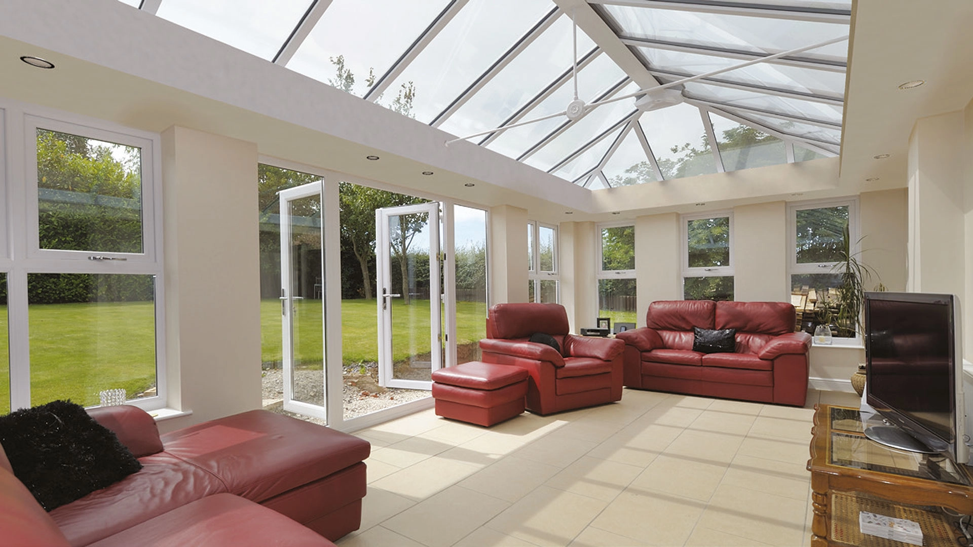 conservatories-shows-an-open-space-with-the-conservatory-double-doors-open-fitted-by-allglass-in-yeovil